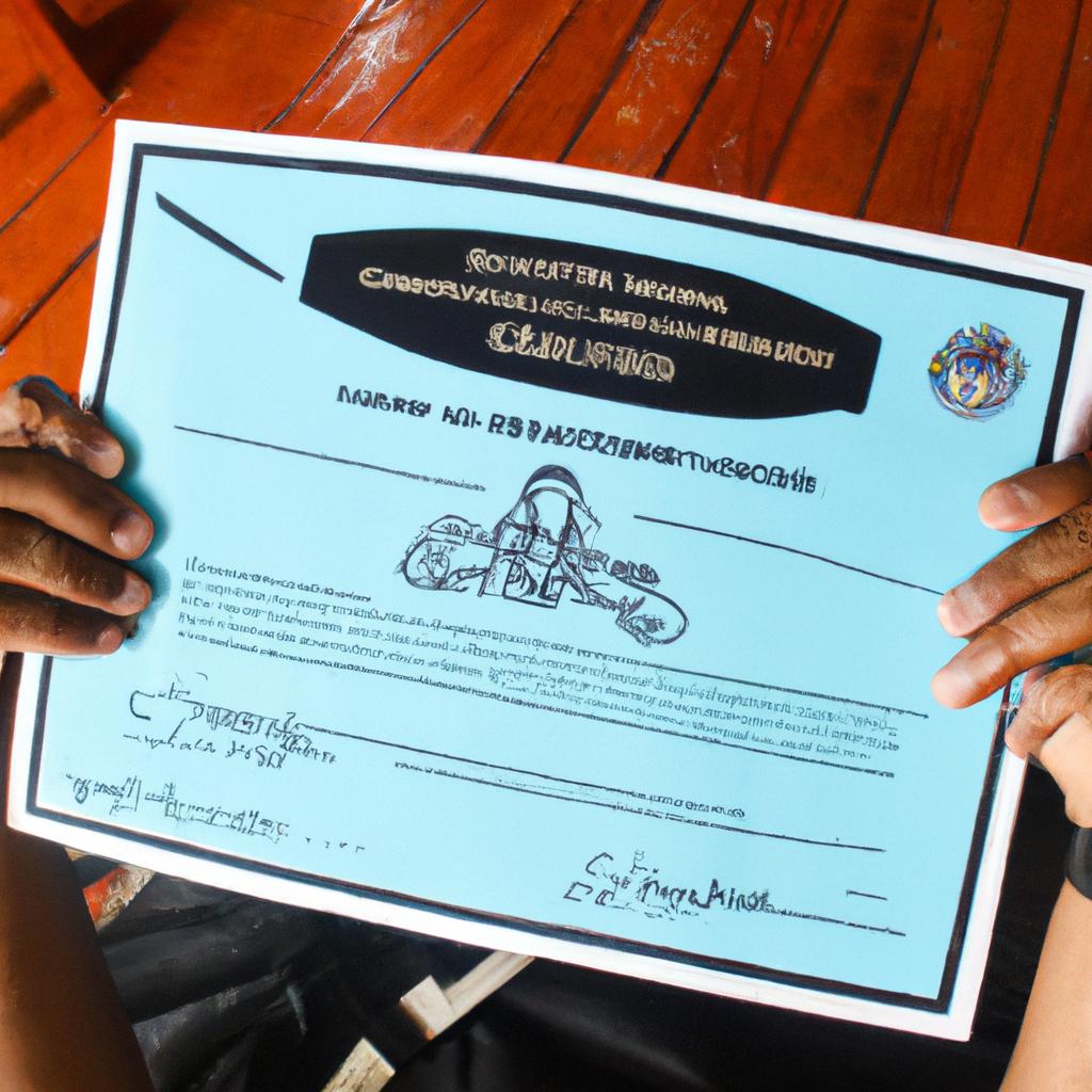 Person holding scuba diving certificate